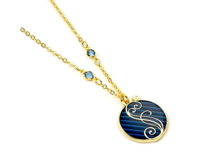 The Carat Shop – wicked blue shiz logo ketting